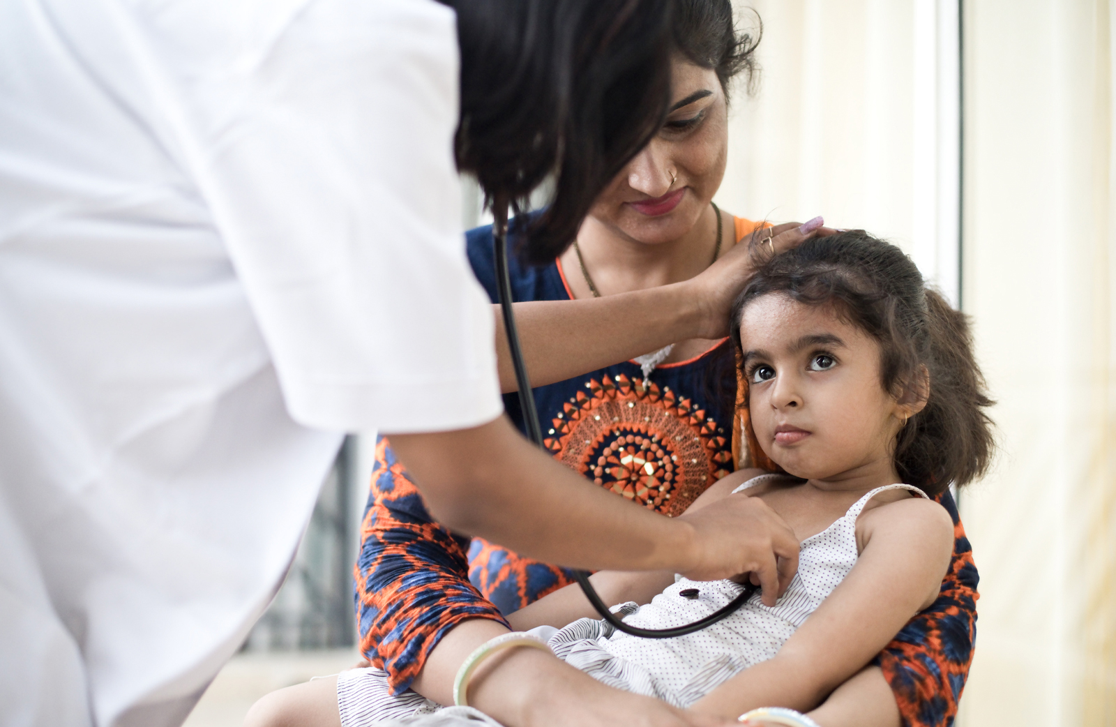 international locum tenens doctor with patient