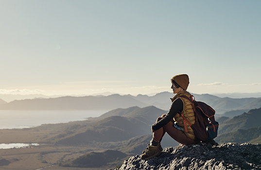 Hiker enjoying the view from a mountain peak