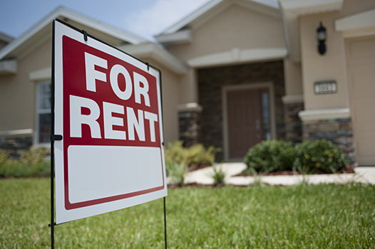 For Rent sign in front of house