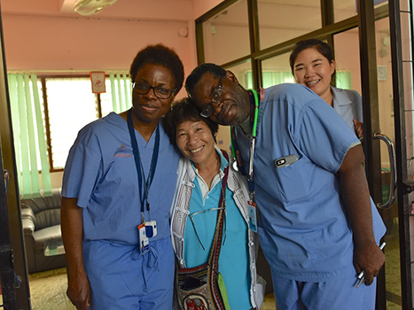 Doctors with a patient on a medical mission