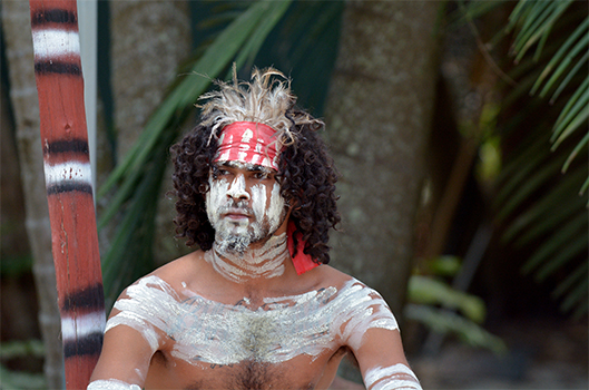 Australian Aborigine man in traditional paint and clothing