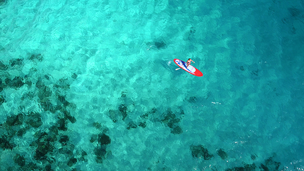 Aerial view of woman on paddleboard in the U.S. Virgin Islands