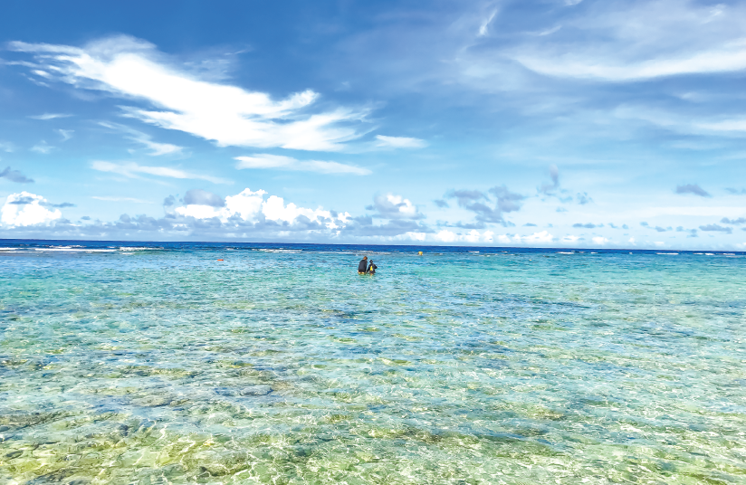 picture of two people in the ocean in Guam