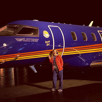 Dr. Samantha Conroy preparing to board an airplane