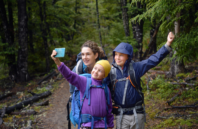 International locum tenens physician taking a selfie with a family