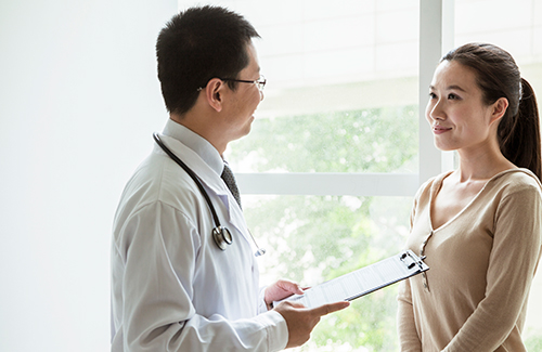 Locum physician in China with patient